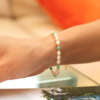 Claudia Bradby Turquoise and Pearl Gold Bracelet - Image 2