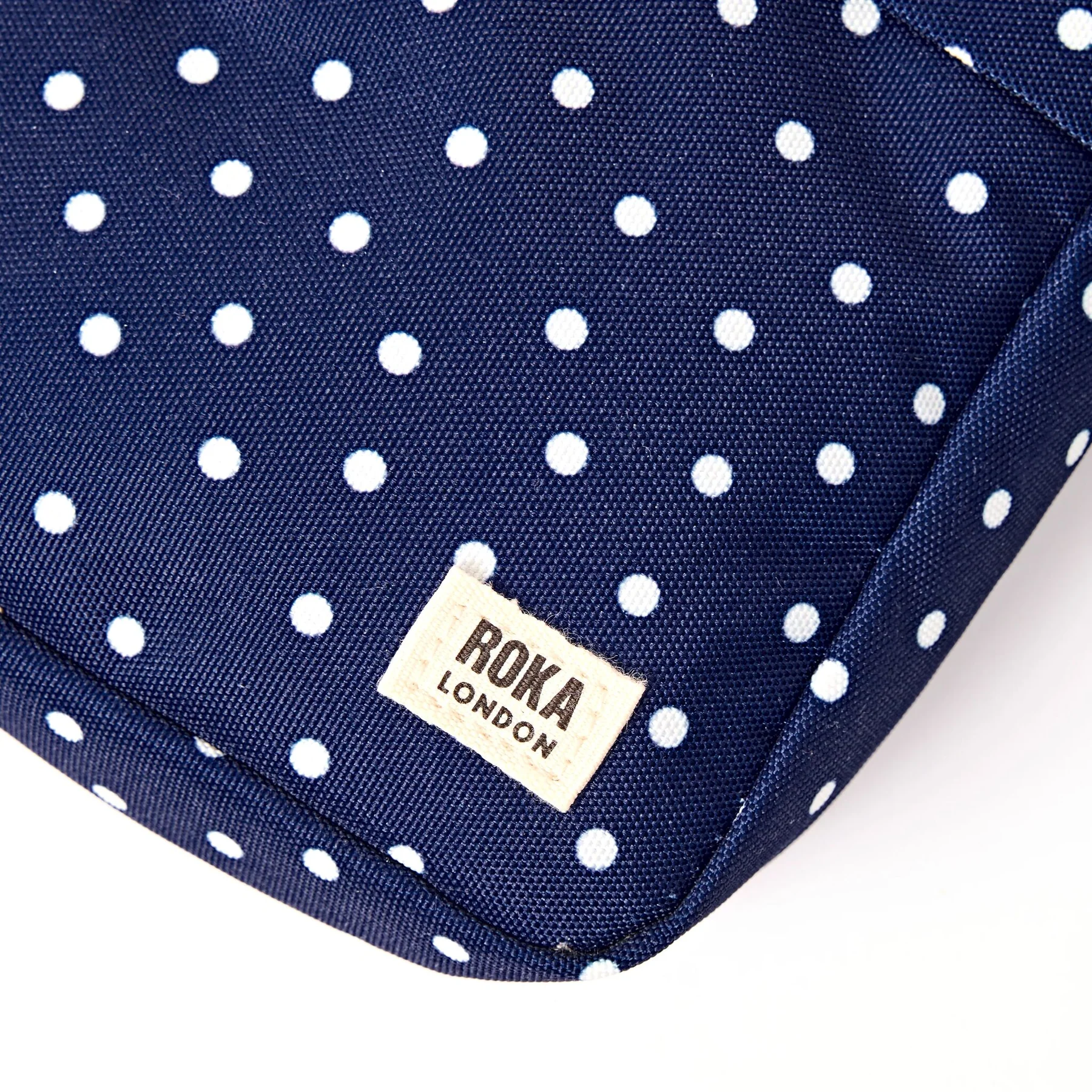 Roka Bond Pocket Recycled Canvas Small Cross Body Bag Navy Polka Dot - Image 9
